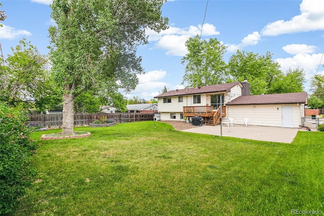 7503 Saulsbury St, Arvada, CO 80003 - view of yard with a wooden deck, a patio, and stairs