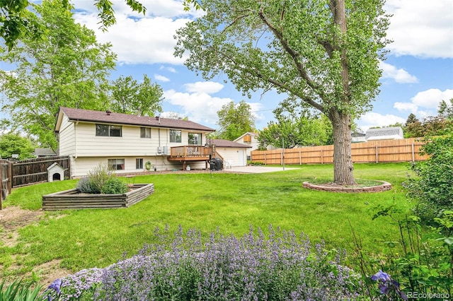 7503 Saulsbury St, Arvada, CO 80003 - back of property with a garage and a deck