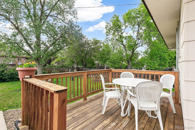 7503 Saulsbury St, Arvada, CO 80003 - wooden terrace featuring outdoor dining area