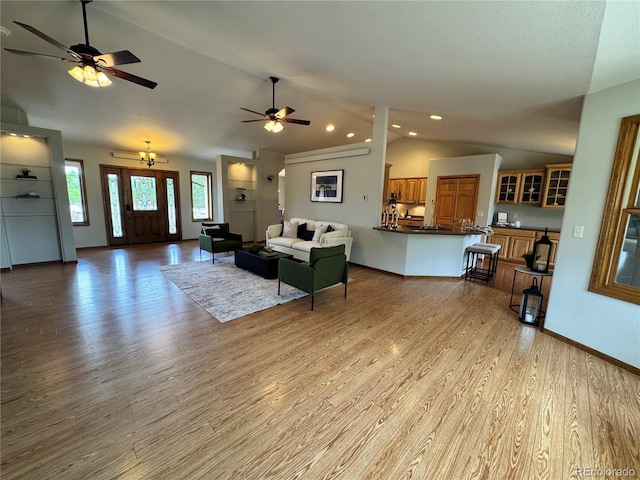 100 River Run Dr, Buena Vista, CO 81211 - living room featuring lofted ceiling, light wood-style floors, recessed lighting, a ceiling fan, and baseboards