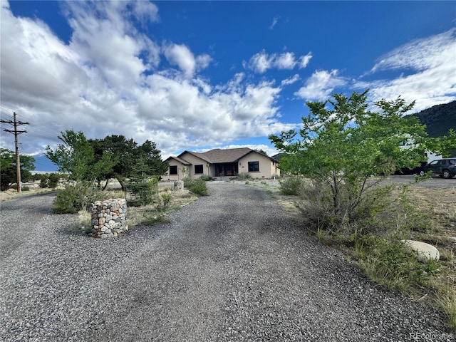 100 River Run Dr, Buena Vista, CO 81211 - ranch-style home featuring driveway and stucco siding