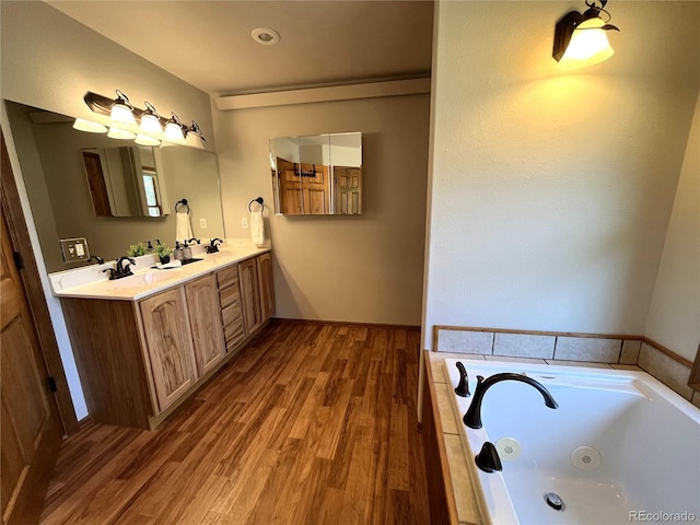 100 River Run Dr, Buena Vista, CO 81211 - bathroom with double vanity, wood finished floors, and a jetted tub