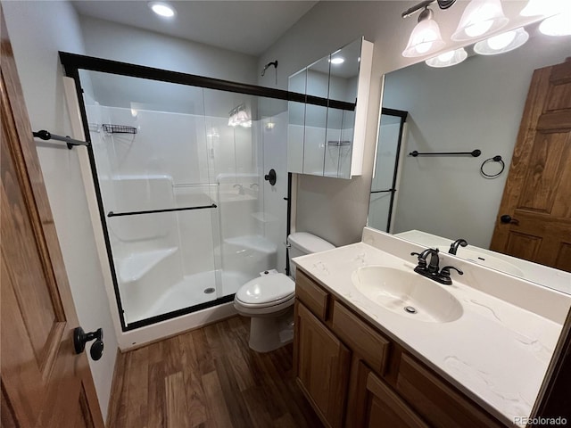 100 River Run Dr, Buena Vista, CO 81211 - bathroom with wood finished floors, a shower stall, and vanity