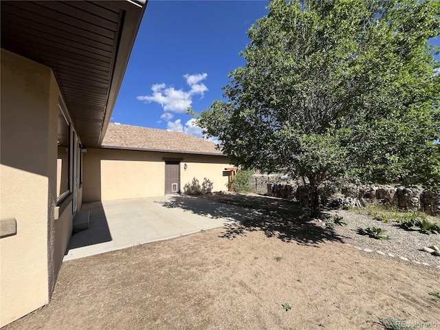 100 River Run Dr, Buena Vista, CO 81211 - view of property exterior with stucco siding and a patio