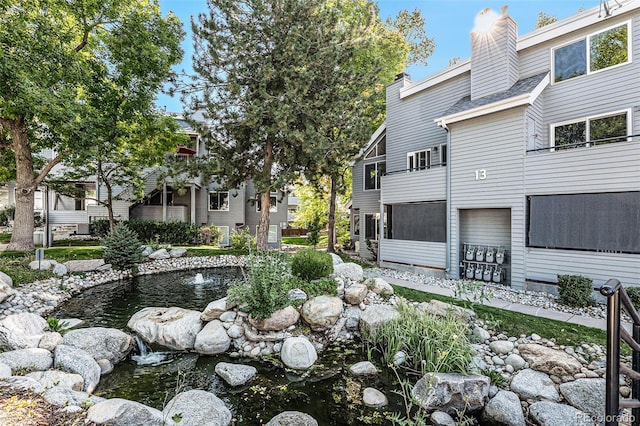 surrounding community featuring a small pond