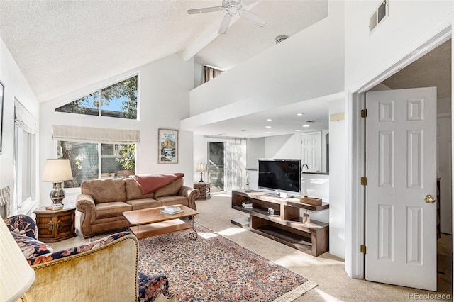 living room with light carpet, high vaulted ceiling, and a textured ceiling