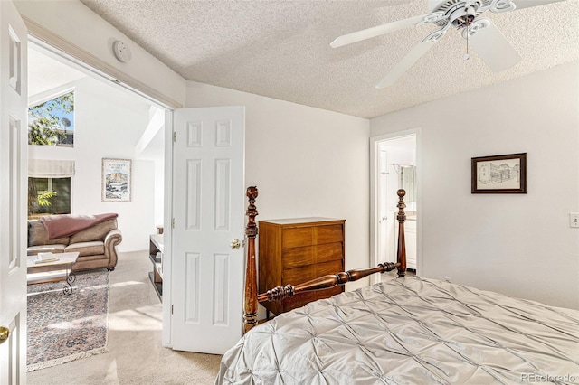 carpeted bedroom featuring vaulted ceiling, a textured ceiling, and ceiling fan