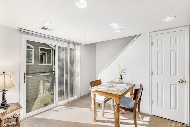 view of carpeted dining area