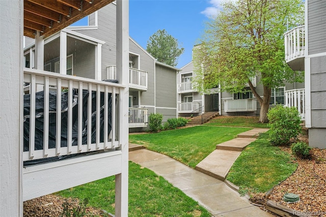 view of home's community with a lawn