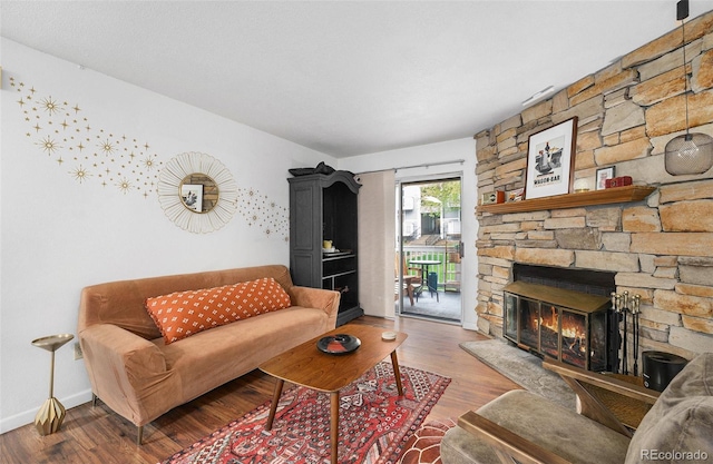 living area with wood finished floors and baseboards