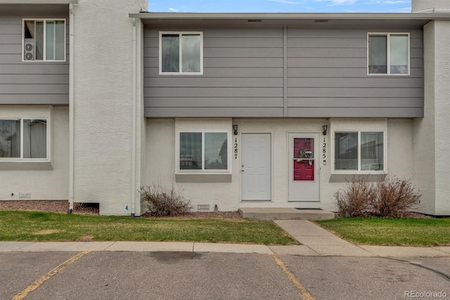 1287 Soaring Eagle Dr, Colorado Springs, CO 80915 - townhome / multi-family property featuring uncovered parking, crawl space, and stucco siding