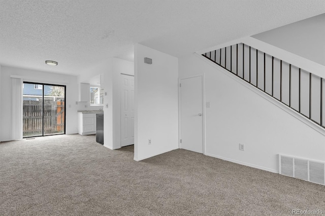 1287 Soaring Eagle Dr, Colorado Springs, CO 80915 - unfurnished living room featuring carpet floors, a textured ceiling, stairway, and baseboards