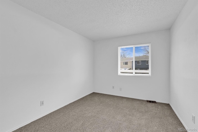 1287 Soaring Eagle Dr, Colorado Springs, CO 80915 - carpeted empty room with a textured ceiling and baseboards