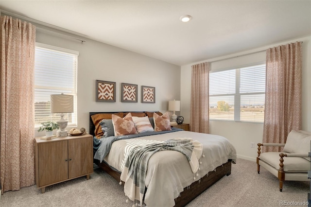 bedroom featuring light colored carpet