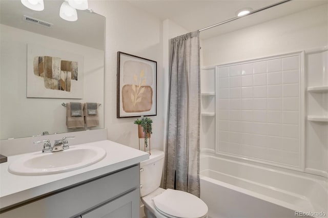 full bathroom with shower / bath combo, vanity, and toilet