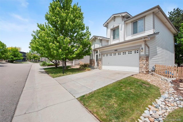 10681 Cherrybrook Cir, Highlands Ranch, CO 80126 - view of front of house featuring a garage, stone siding, and concrete driveway