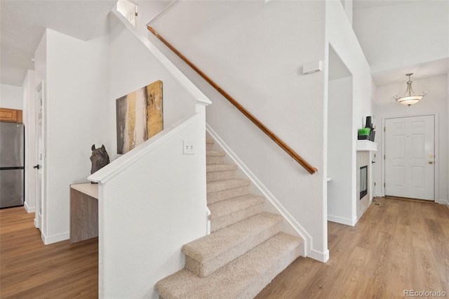 10681 Cherrybrook Cir, Highlands Ranch, CO 80126 - stairway with wood finished floors and baseboards