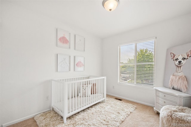 10681 Cherrybrook Cir, Highlands Ranch, CO 80126 - carpeted bedroom with baseboards and a crib