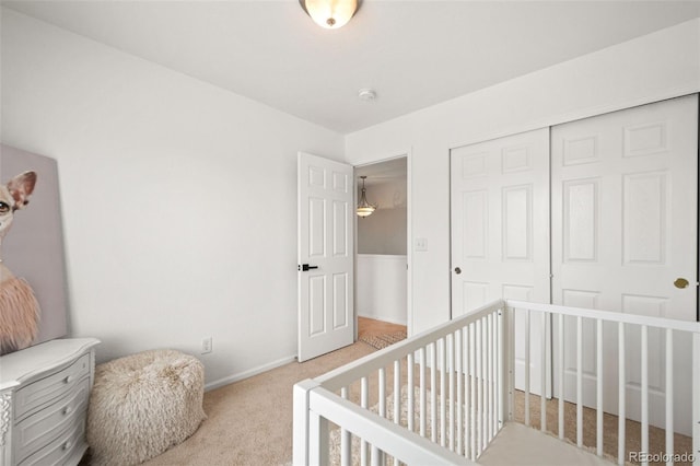 10681 Cherrybrook Cir, Highlands Ranch, CO 80126 - bedroom featuring light carpet, a closet, and baseboards