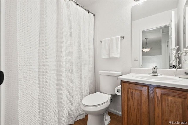 10681 Cherrybrook Cir, Highlands Ranch, CO 80126 - full bath featuring toilet, vanity, wood finished floors, and curtained shower