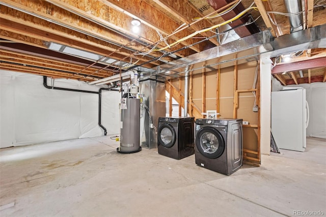 10681 Cherrybrook Cir, Highlands Ranch, CO 80126 - unfinished basement featuring washing machine and clothes dryer, freestanding refrigerator, and water heater