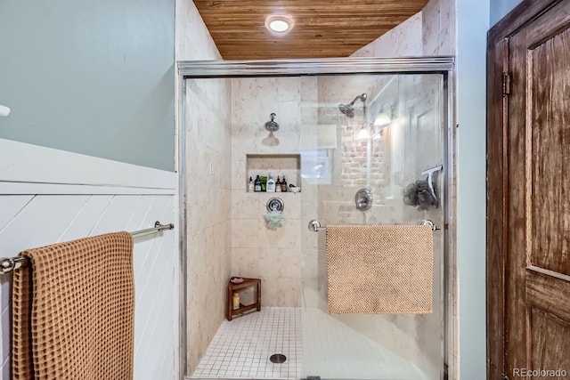 bathroom with wooden ceiling and an enclosed shower