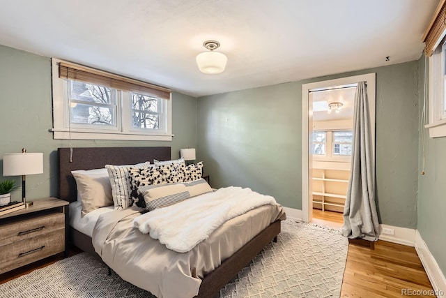 bedroom with wood-type flooring