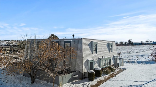 view of snow covered property