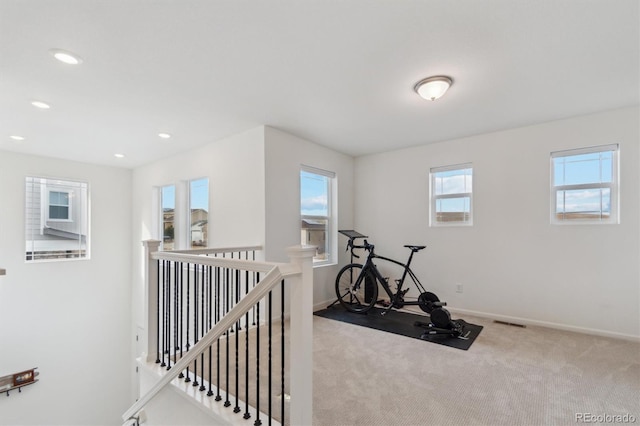 exercise room with visible vents, baseboards, carpet flooring, and recessed lighting