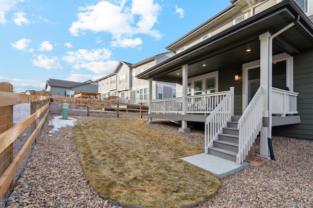 view of yard with a fenced backyard and a residential view