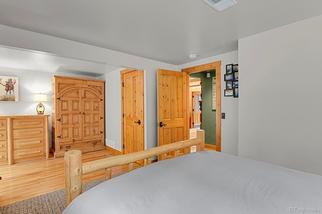 8905 Carol Ln, Conifer, CO 80433 - bedroom featuring light wood-style flooring