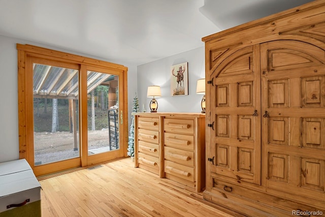 8905 Carol Ln, Conifer, CO 80433 - bedroom with access to exterior and light wood-type flooring