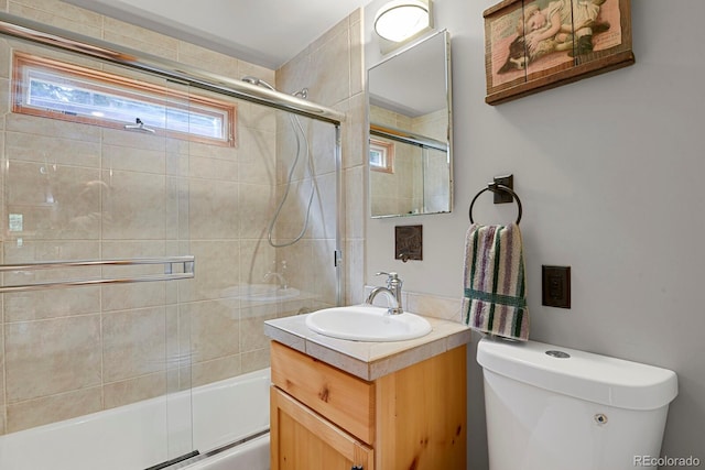 8905 Carol Ln, Conifer, CO 80433 - full bath featuring toilet, shower / bath combination with glass door, and vanity