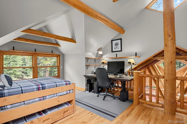 8905 Carol Ln, Conifer, CO 80433 - bedroom with wood finished floors, multiple windows, and a desk