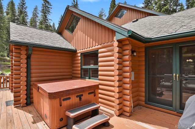 8905 Carol Ln, Conifer, CO 80433 - wooden deck with a hot tub and french doors
