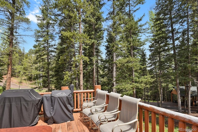 8905 Carol Ln, Conifer, CO 80433 - wooden terrace with a grill
