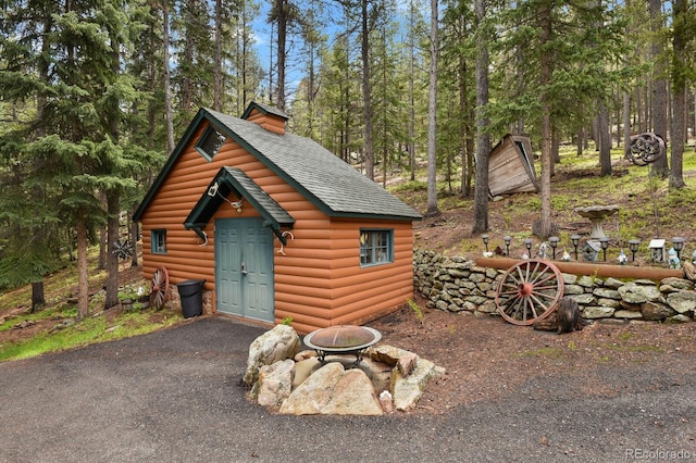 8905 Carol Ln, Conifer, CO 80433 - view of outbuilding with an outdoor fire pit