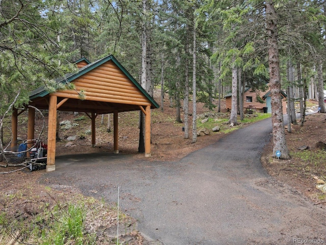 8905 Carol Ln, Conifer, CO 80433 - surrounding community featuring asphalt driveway and a detached carport