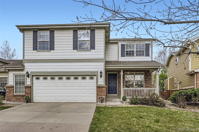 traditional home featuring covered porch, brick siding, and an attached garage