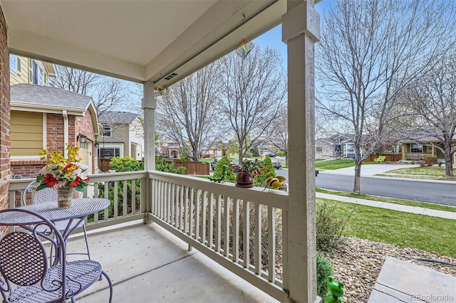 view of patio / terrace featuring a porch and a residential view