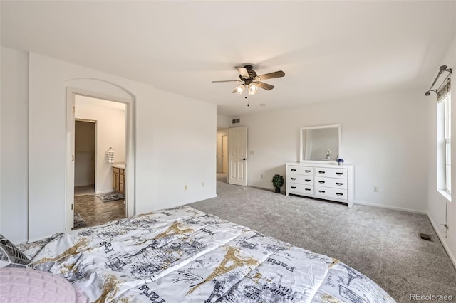 bedroom featuring visible vents, a ceiling fan, baseboards, and carpet floors