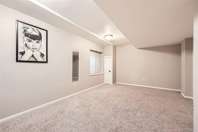 basement with carpet flooring and baseboards