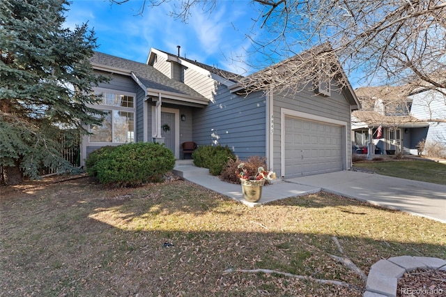 view of front facade featuring a garage and a front lawn