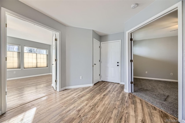 unfurnished bedroom featuring light wood-type flooring