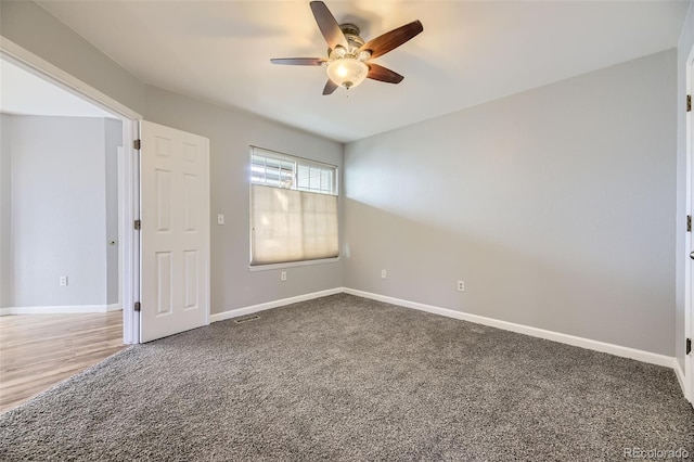 unfurnished room featuring ceiling fan and carpet floors