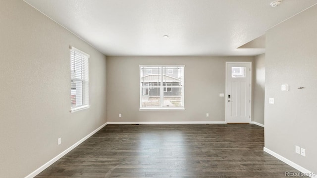 entrance foyer with dark hardwood / wood-style flooring