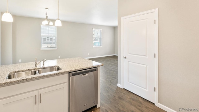 kitchen featuring white cabinetry, sink, pendant lighting, and dishwasher