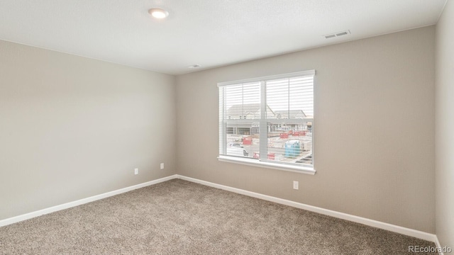 empty room featuring carpet