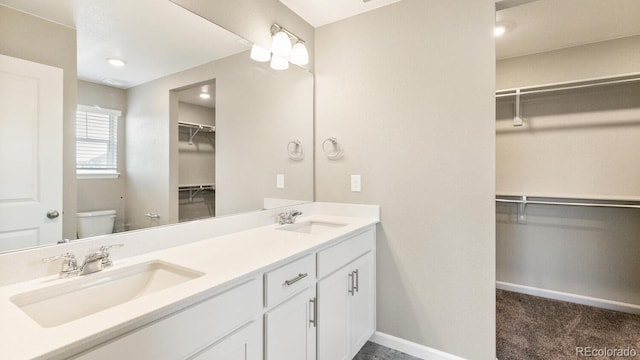 bathroom with toilet and vanity