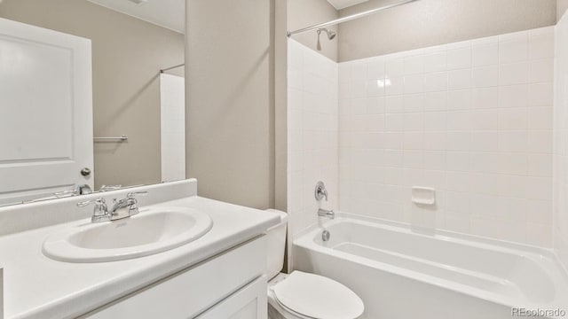 full bathroom featuring toilet, vanity, and shower / washtub combination